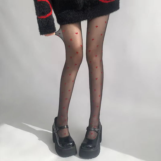 Collant Noir Fin pour Femme Motifs Coeur sur les jambes d'une femme