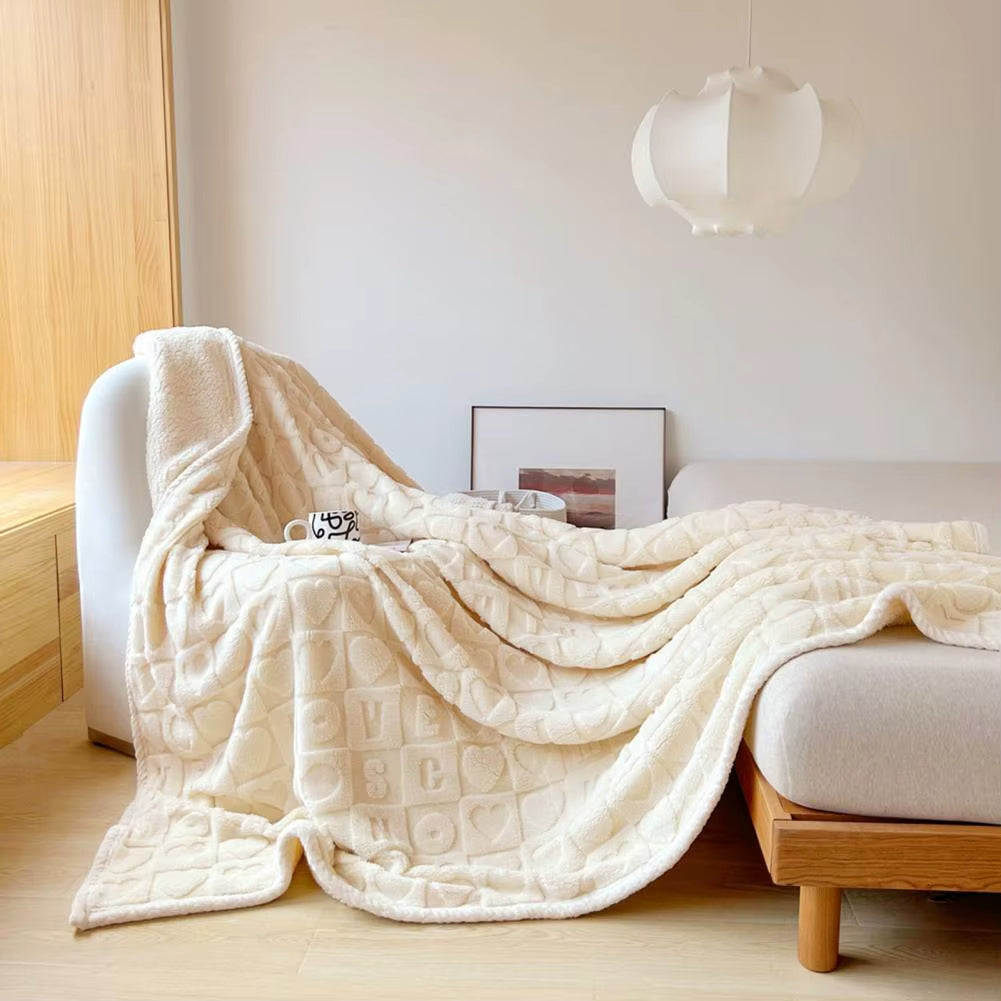 Plaid Confortable Coeur sur un fauteuil et un lit